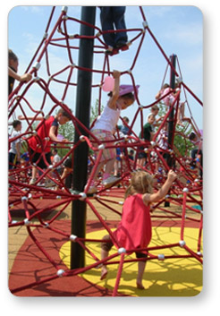 Children climbing a pyramid net